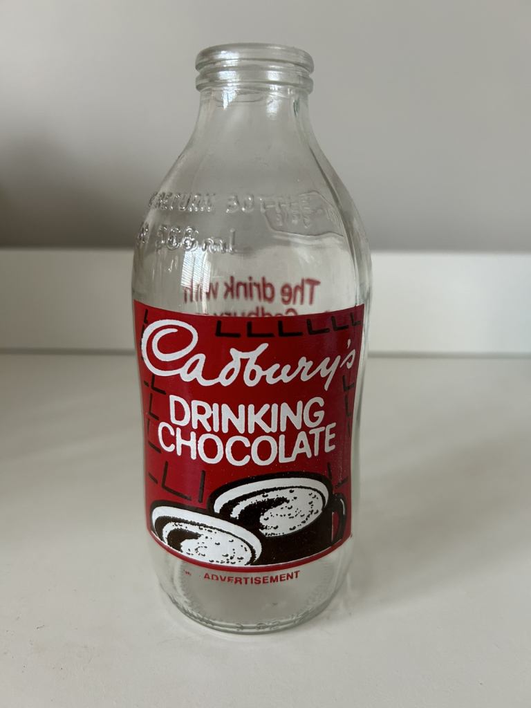 2 vintage milk bottles Cadbury advertising from the 1980s