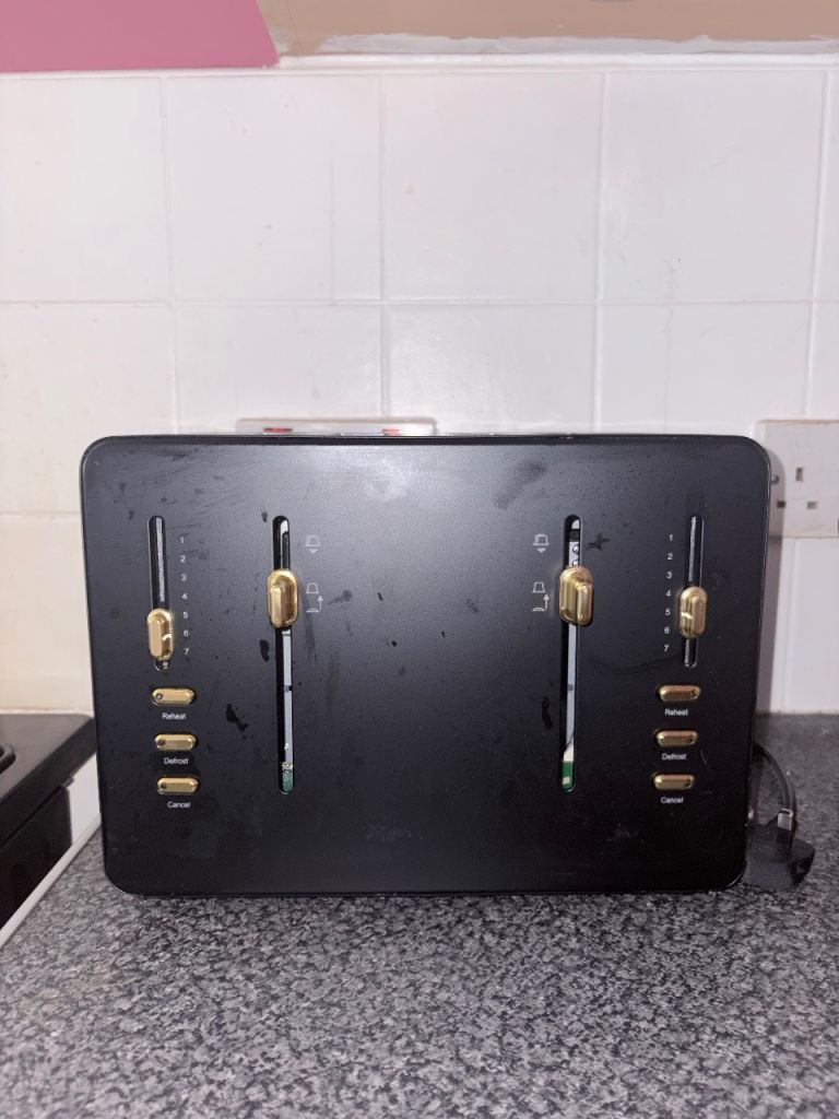 Modern black and gold toaster