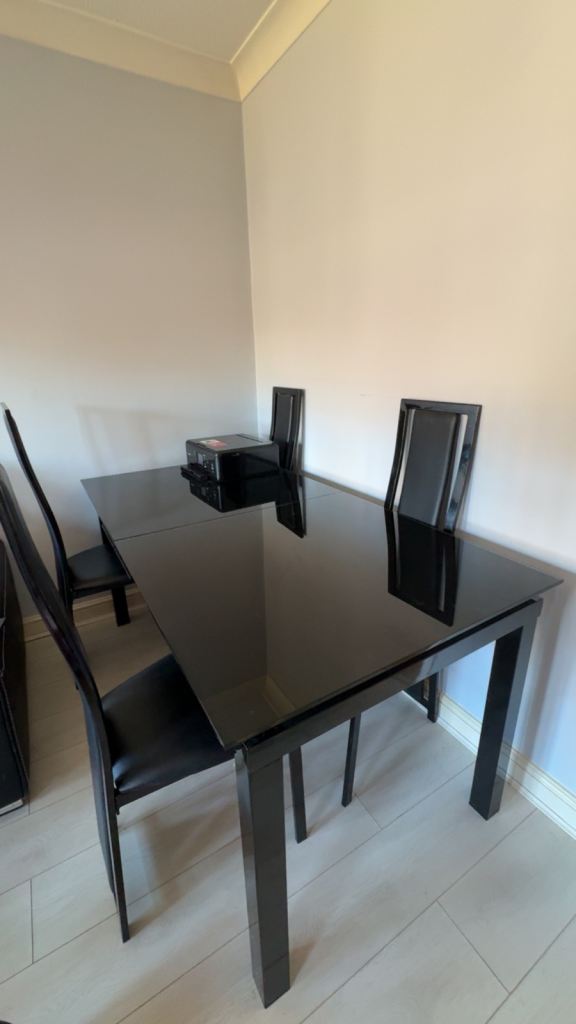 Black Dining Table and Four Chairs – Good Condition
