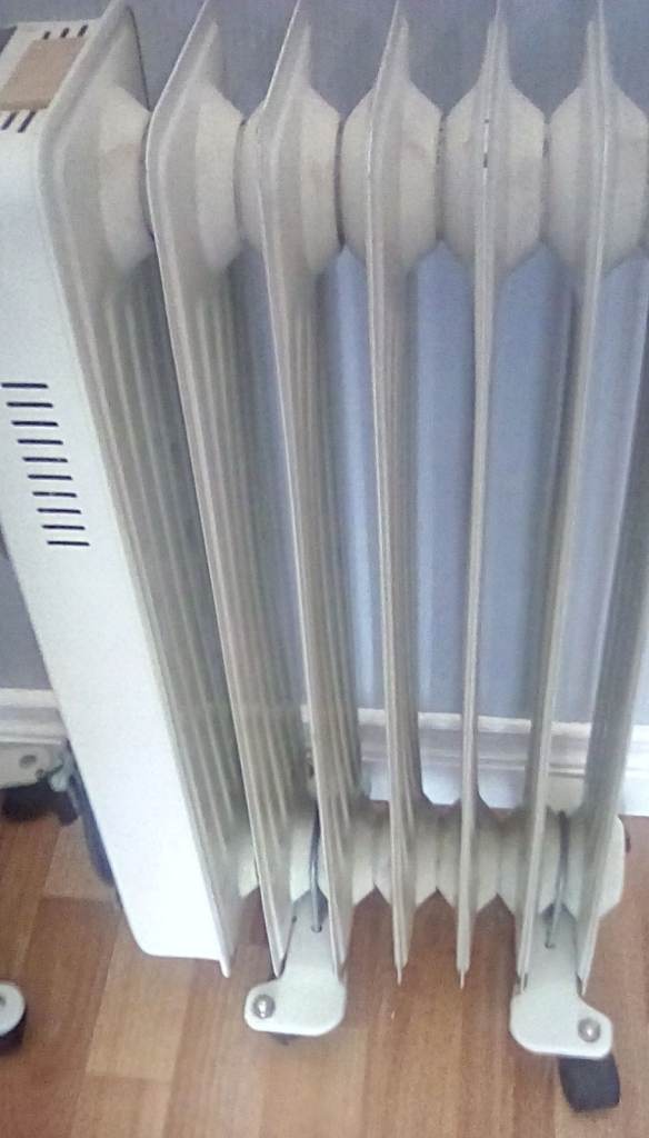 Two oil -Filled Electric Radiator Heater on Wheels, working as they should, £20 for both.