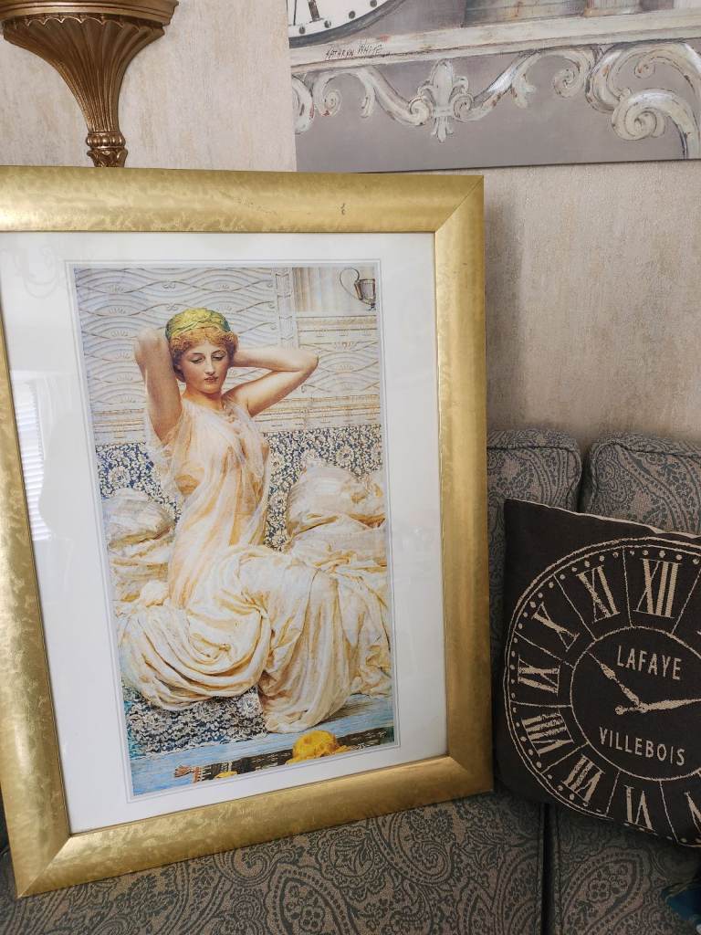 Large gold framed picture of woman 