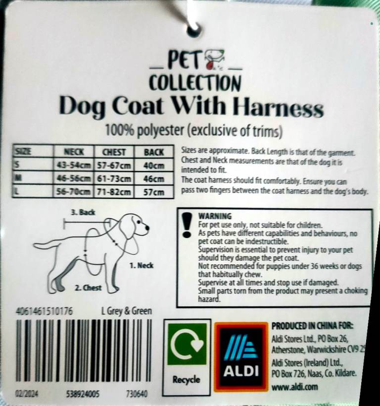 Dog coat with sewn in harness