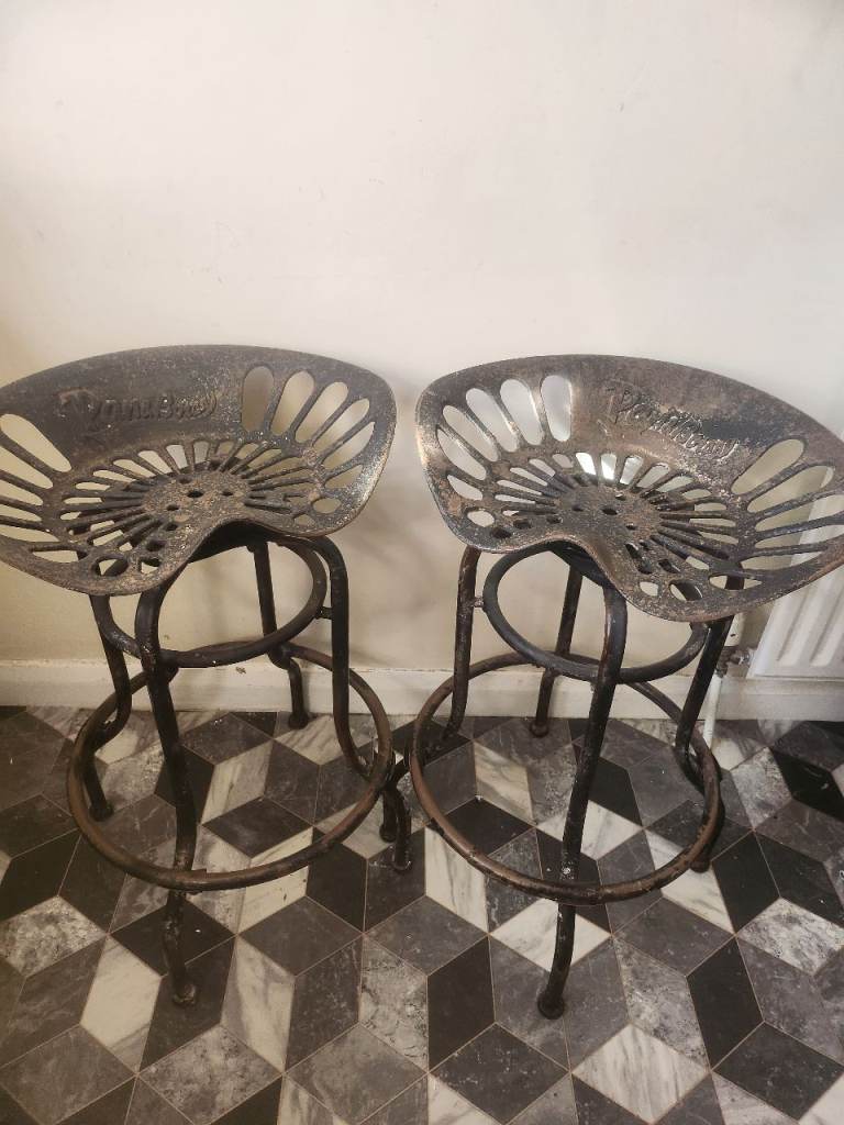 PAIR OF VINTAGE TRACTOR SEAT STOOLS