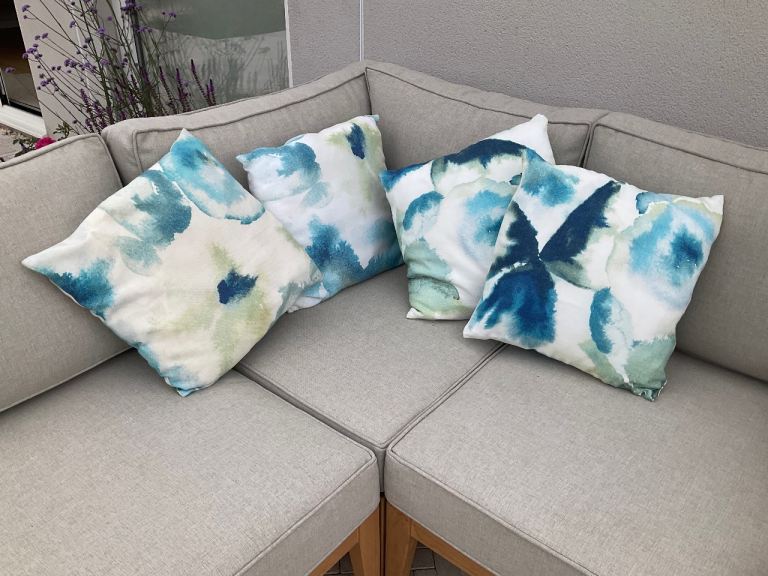 4 Cushions in Linen. Neutral, blue green design with insert pads. Made to order from John Lewis. 
