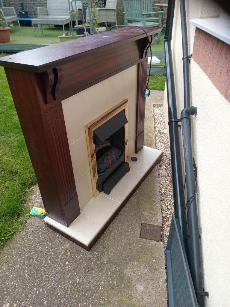 Fire surround with built in electric fire 