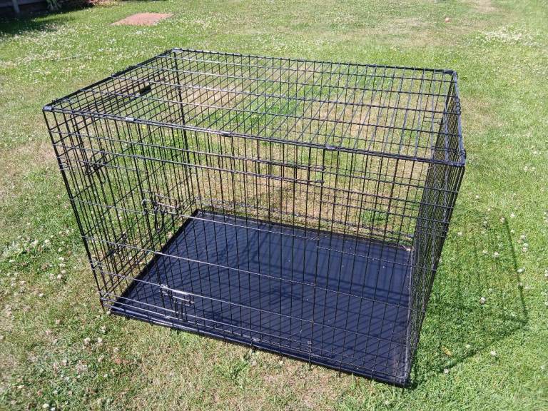 Large dog crate with cover.