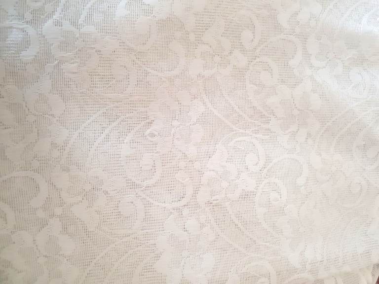 White Arched Window Net Curtain with a Floral Design