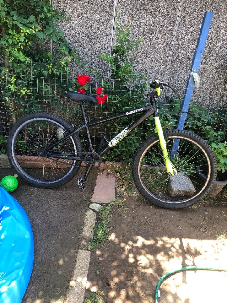 Price negotiation Black Mountain Bike with Neon Green Forks