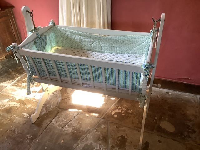 Traditional wooden swinging crib