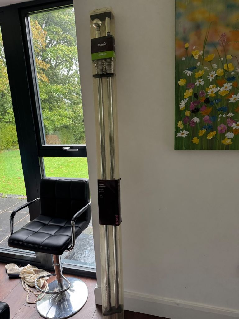 BNWT Extendable chrome curtain pole.