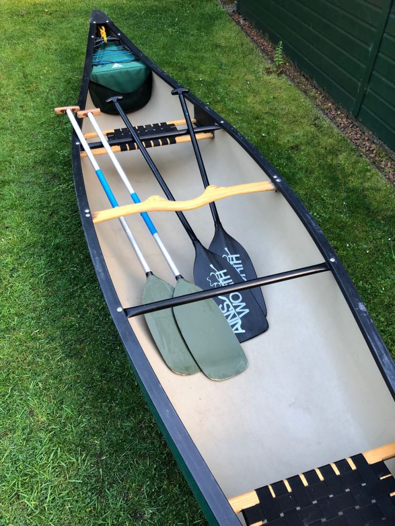 Used Wenonah Southfork canoe for sale with two pairs of paddles and flotation