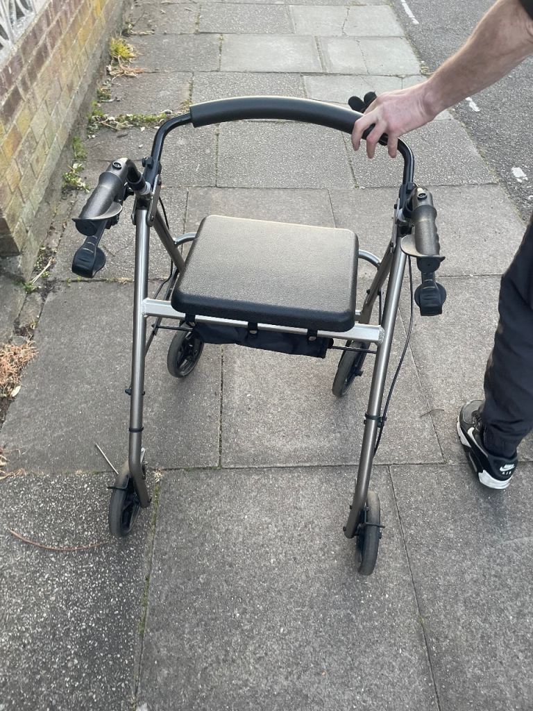 Fold up walking aid with seat 