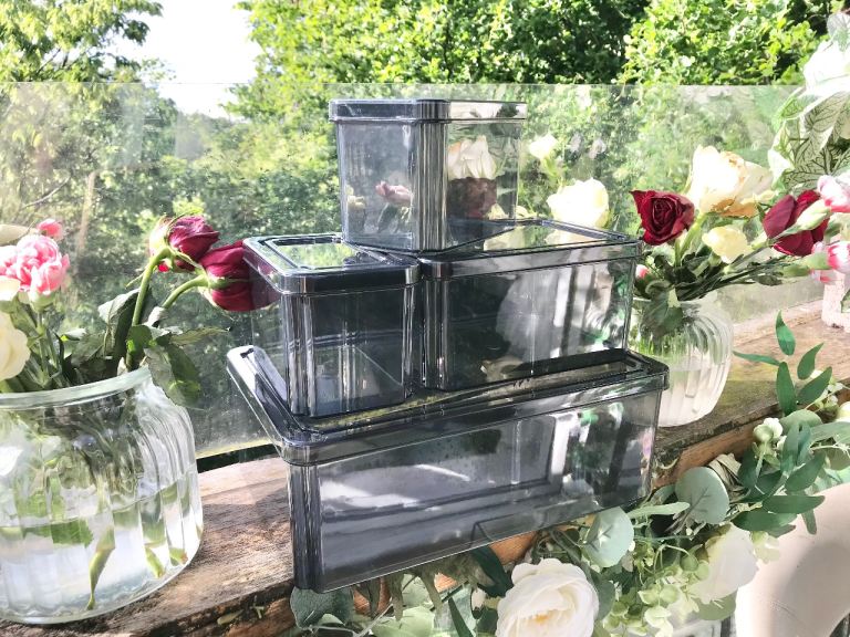 Good quality. Set of 4 Black tint plastic storage boxes Only used a few times, some signs of age