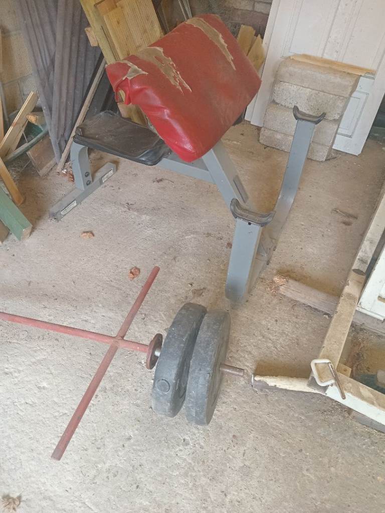 Preacher bench and t bar row with 20kg of weights