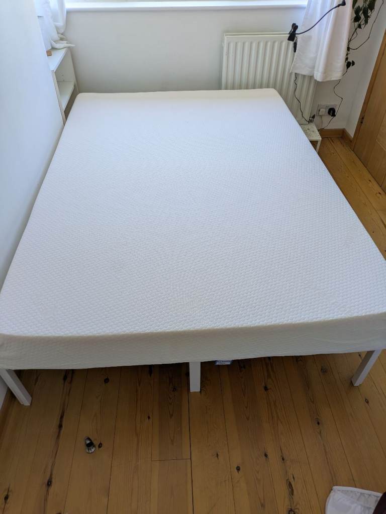 Large double bed with new mattress 