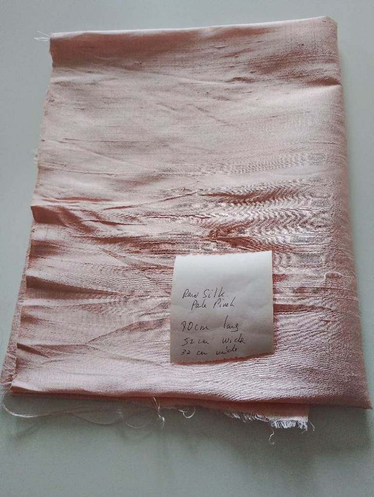 Raw silk. Pale pink fabric remnant