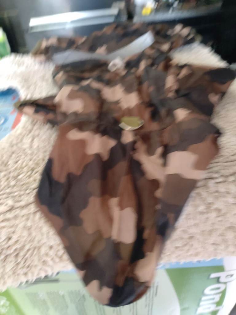 Dogs shower proof coat with arms legs and hood pick up only 