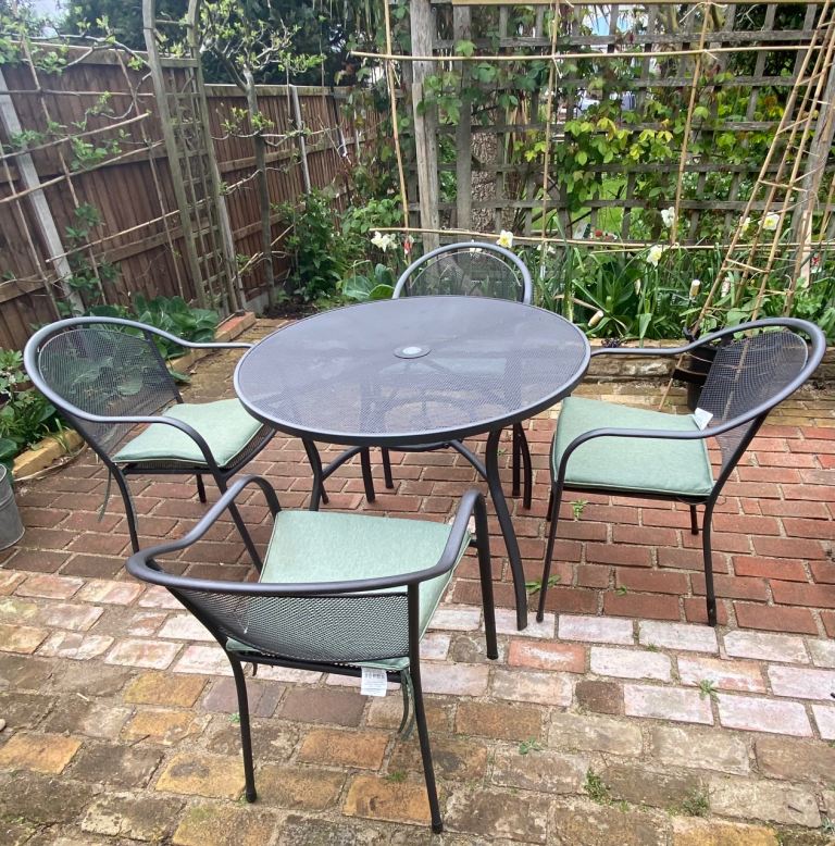 Metal garden table and four chairs and waterproof covers for table and chair chairs
