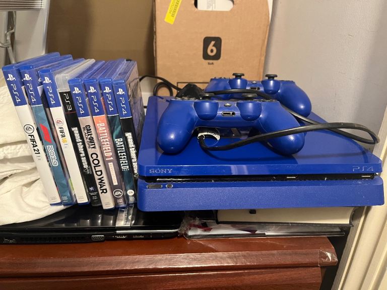 Sony PS4 Blue Console with Two Controllers & Games