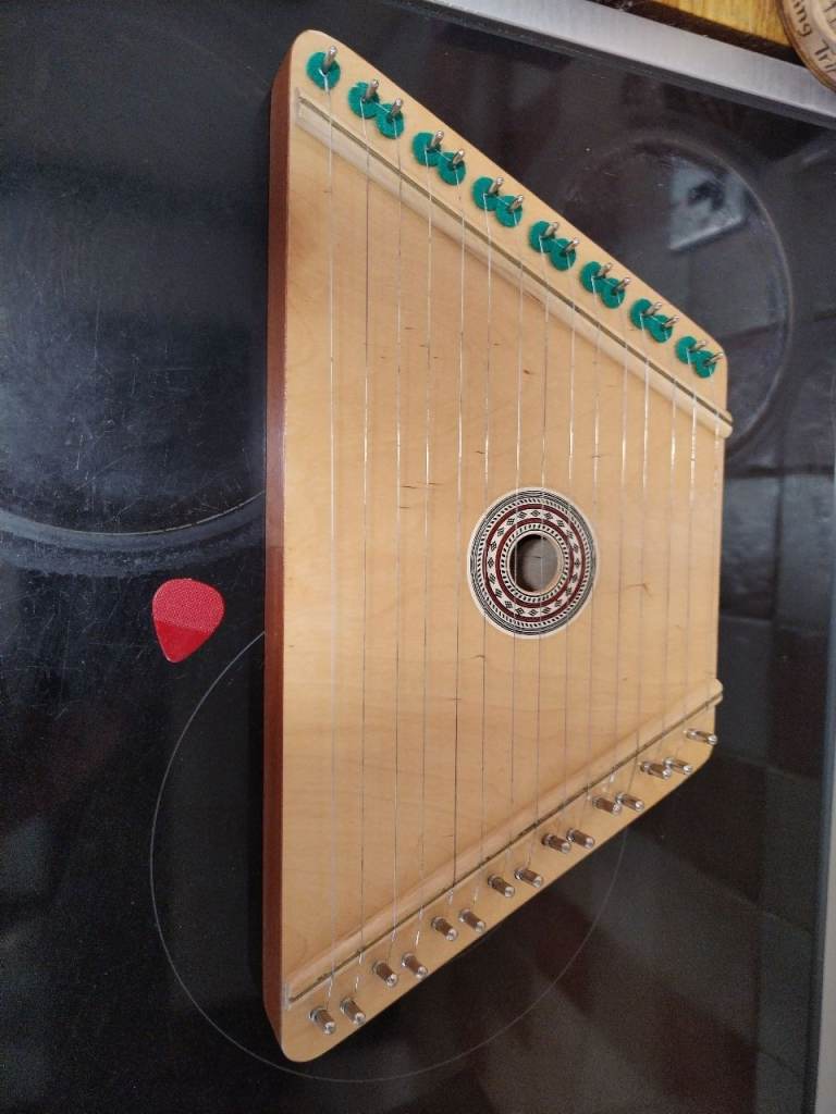 Lap harp with music looks new