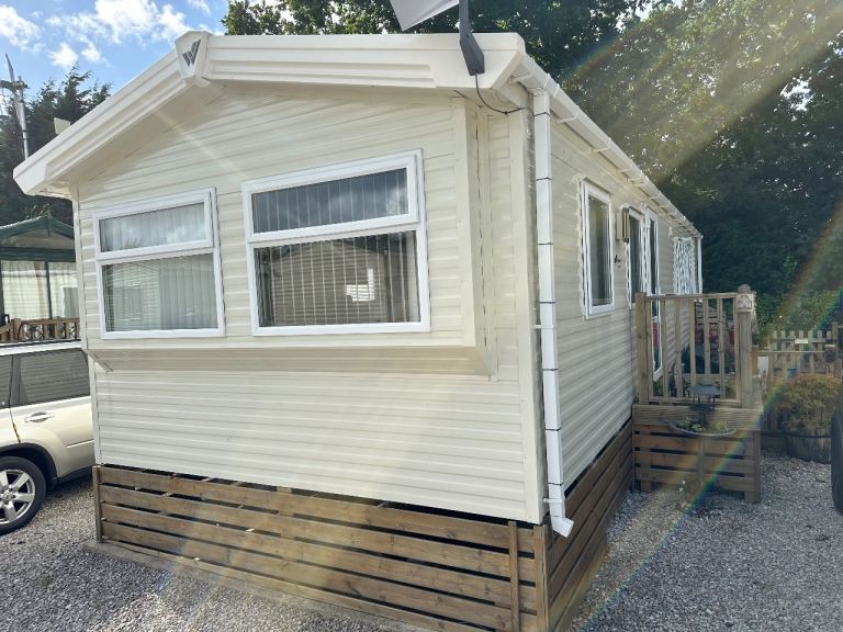 Static caravan for sale with enclosed decking on 12 month park