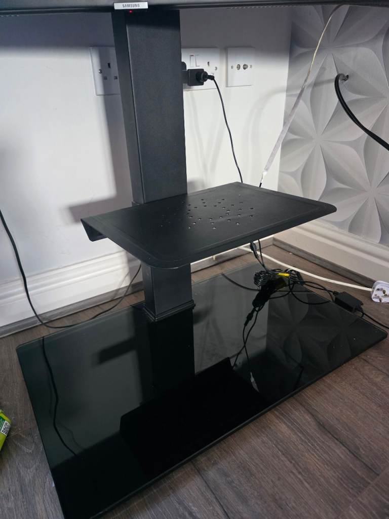 Black glass tv stand with shelf