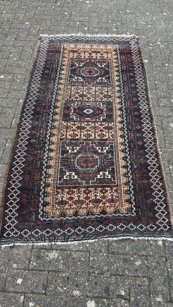 A vintage Afghan Baluchi rug 