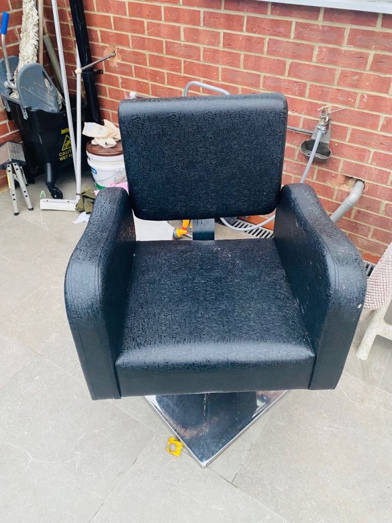 Black barbering salon chair 