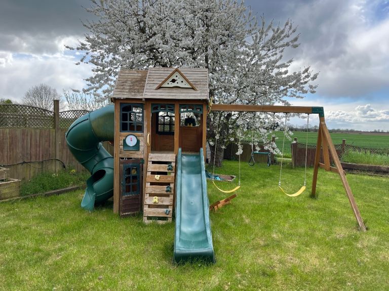 Children’s play house, swings and slides 