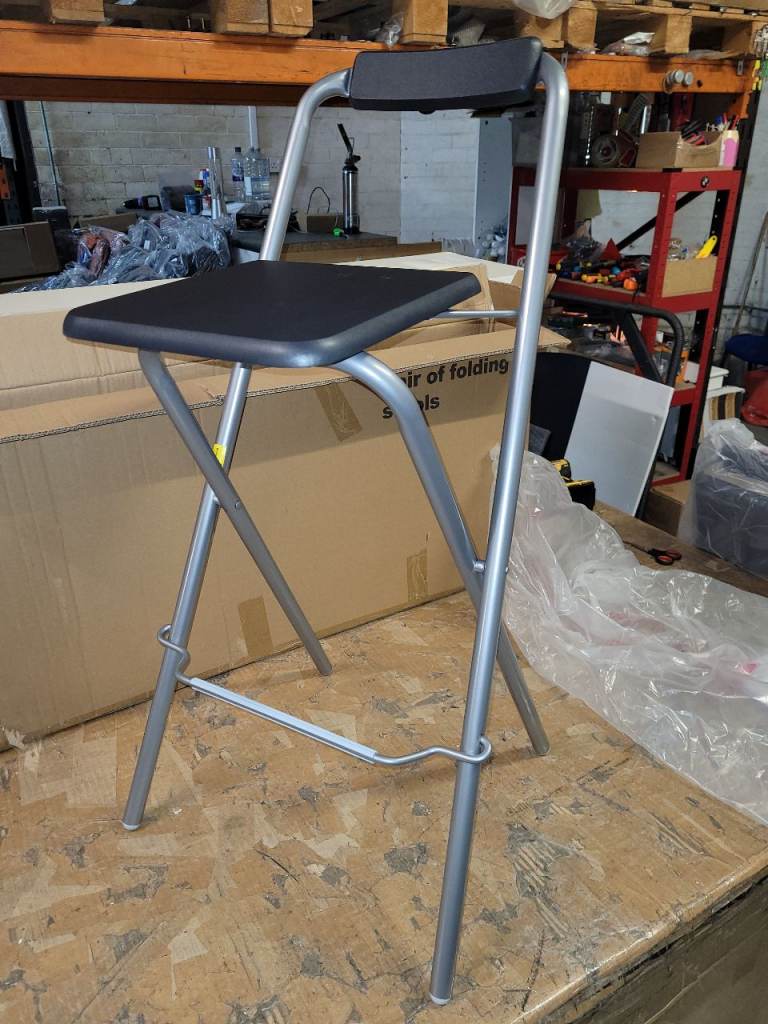 A new pair of black x silver folding bar stools the measurements are .