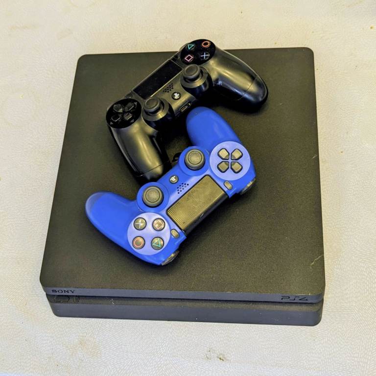 Sony PlayStation 4 (PS4) Console with Two Controllers