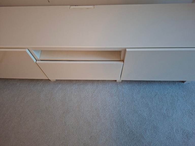 IKEA white tv unit besta with white glass top 