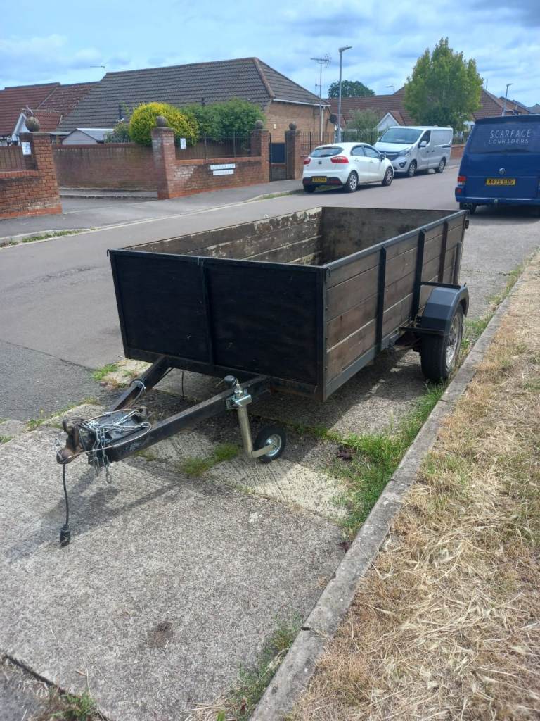 Large trailer with a drop down at the back.