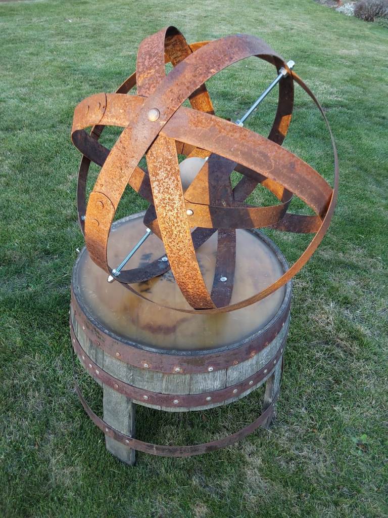 Handcrafted rustic garden art from recycled whisky barrel materials 