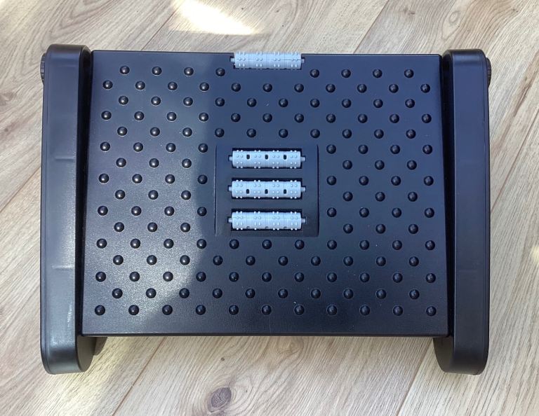 Adjustable Footrest with Massage Rollers.