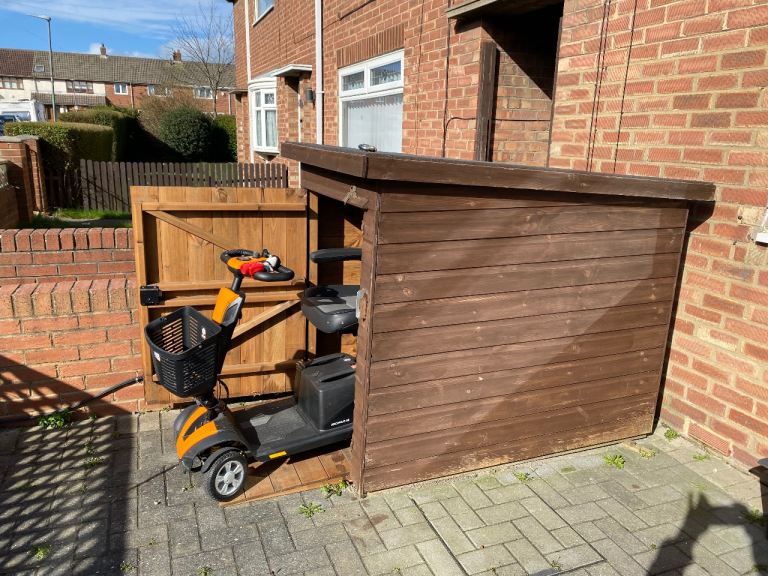 Mobility scooter with purpose built shed