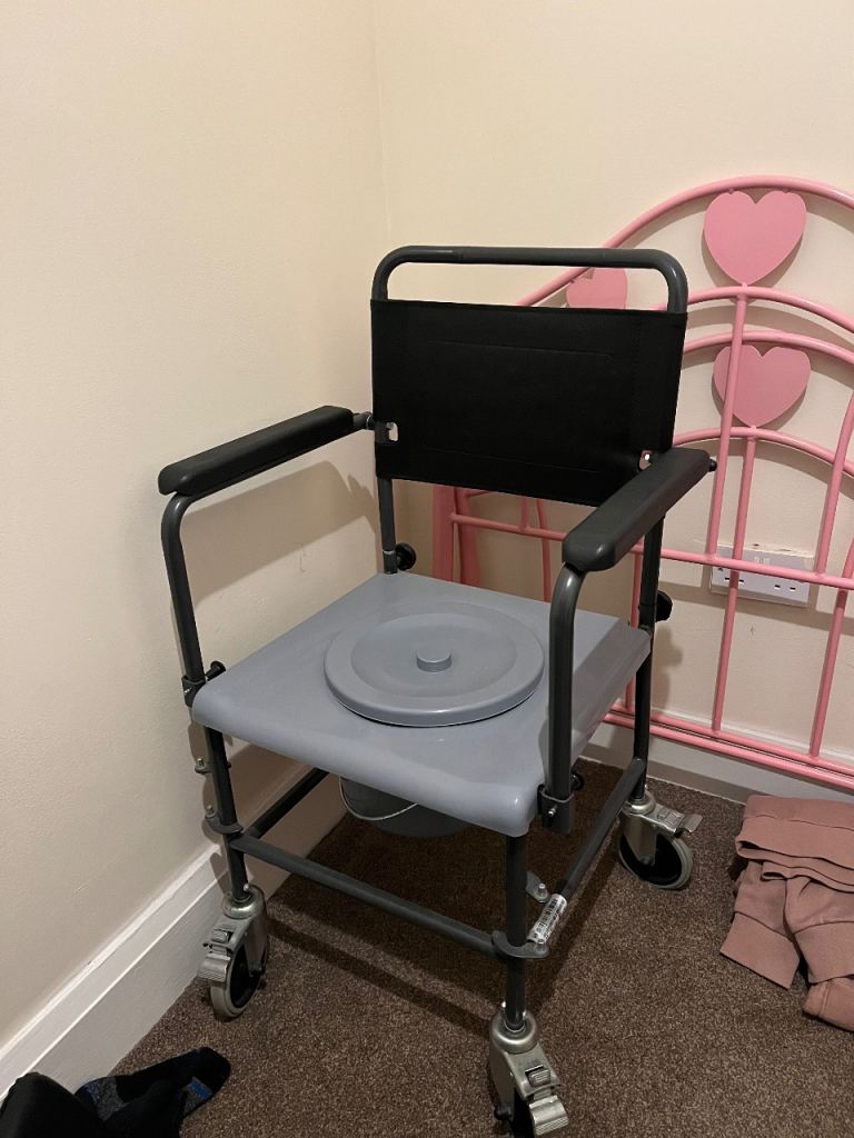 Commode chair on wheels with brakes by Invacare Aquatec shower commode