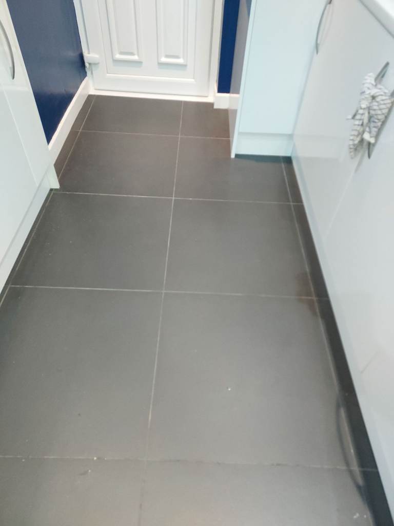 image for Quartz countertop and new black floor tiles