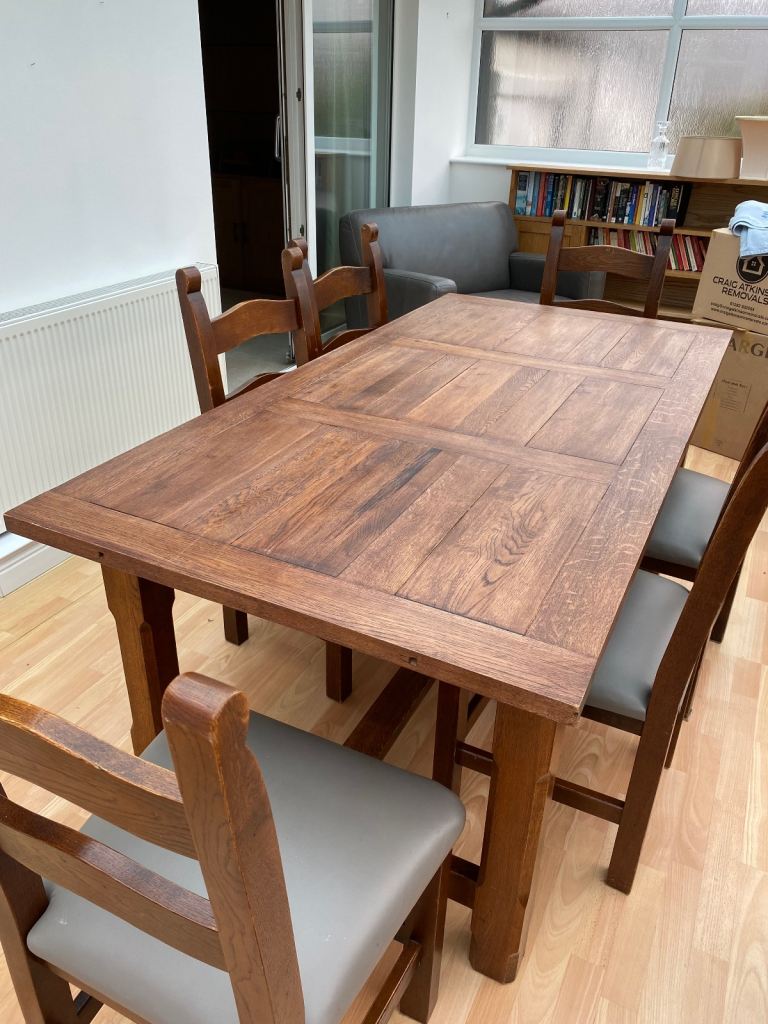 Solid oak dining table and chairs