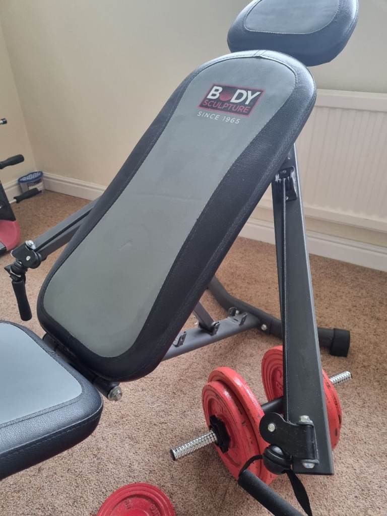 Fitness bench and chest stretch complete with x2 Dumb bells and weights 