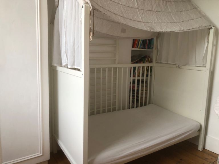 Stokke Home white cot bed with canopy and curtains