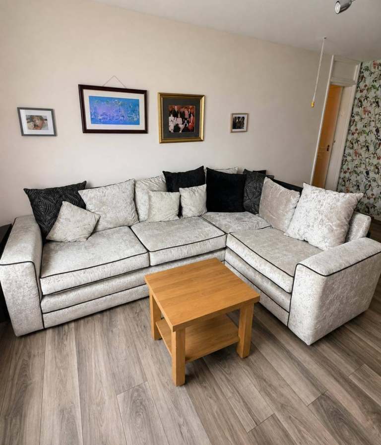 Grey Fabric Corner Sofa with Black Piping – Good Condition