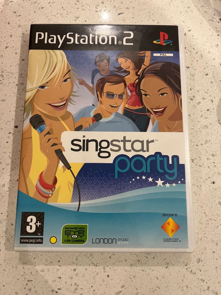 PlayStation 2 with games and microphones 