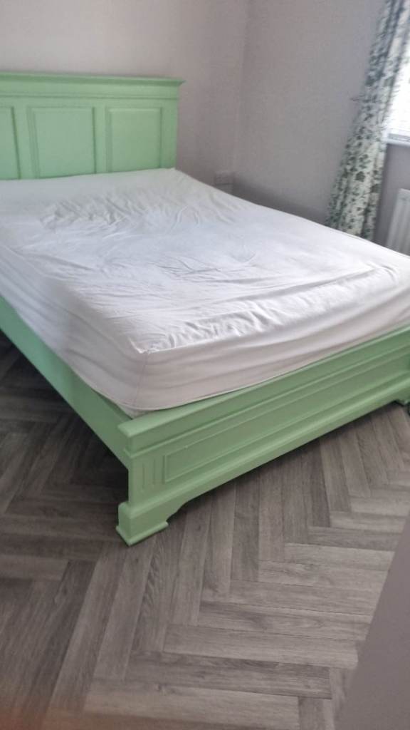 Green wooden Double bed.