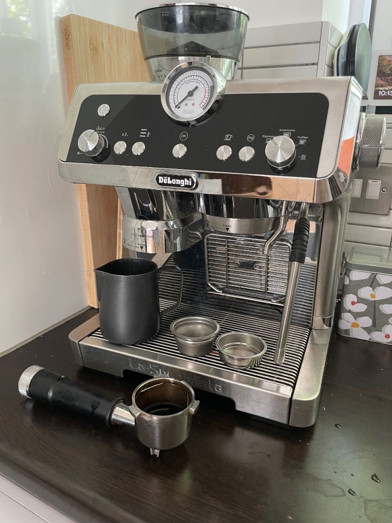 Delonghi Espresso Maker and supplies