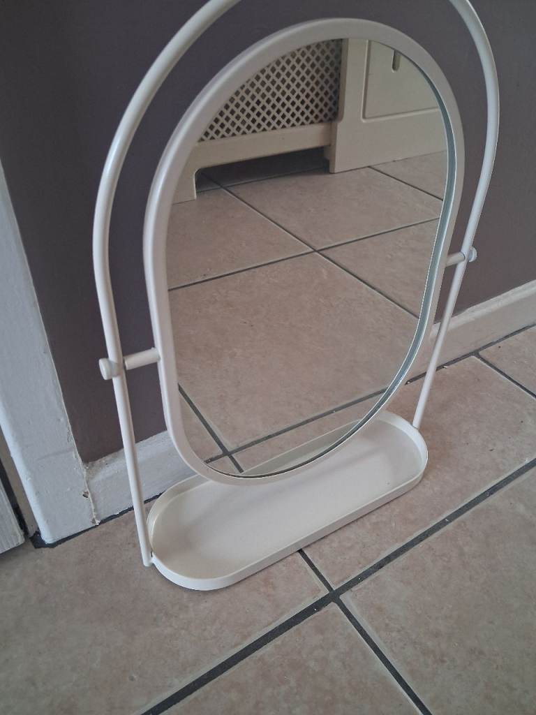 Brand new oval mirror on stand with shelf to base