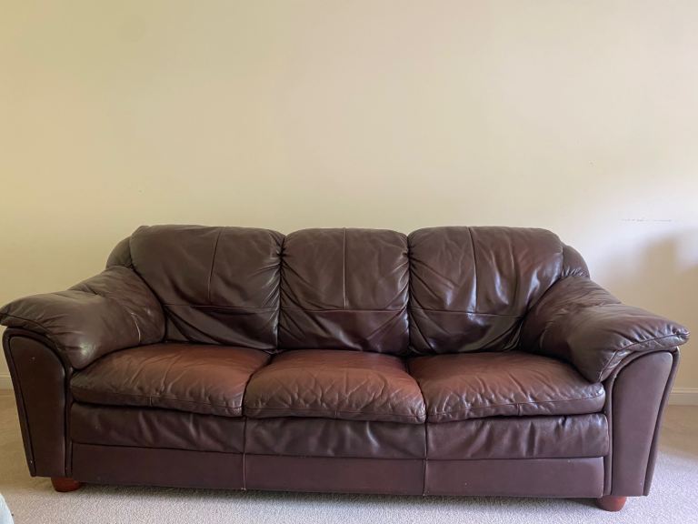Brown leather three seater sofa 