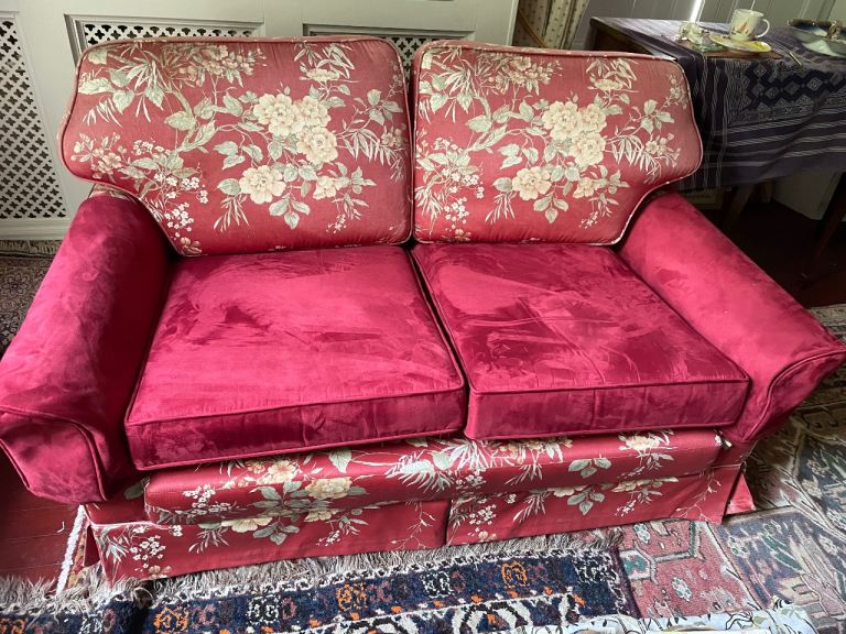 Red Floral Two-Seater Sofa – Good Condition