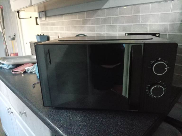 Black microwave as new