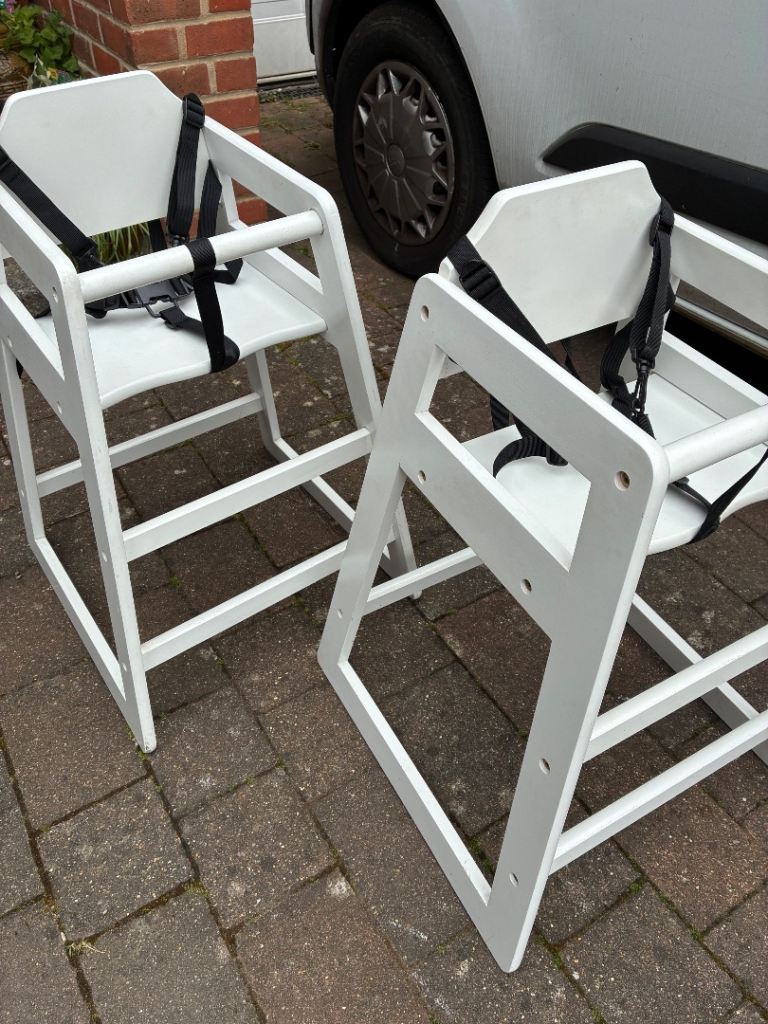 Two robust wooden high chairs for young children